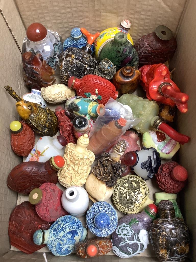 A group of approximately forty Chinese snuff bottles